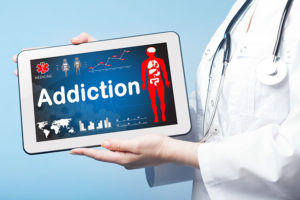 Addiction Treatment on Doctor's Tablet